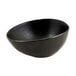 A black porcelain ramekin with white specks.