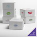 A group of white customizable bakery boxes with logos on them.