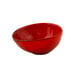 A white porcelain ramekin with red chili inside.