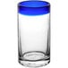 A clear Acopa cooler glass with a blue rim.