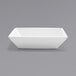 A white rectangular bowl on a gray background.