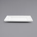 a white rectangular plate on a gray background