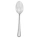 A close-up of the handle of a Walco stainless steel dessert spoon with beaded trim.
