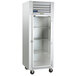 A white refrigerator with glass doors.