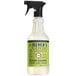 A white bottle of Mrs. Meyer's Lemon Verbena glass cleaner with a black sprayer.