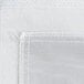 A close up of a white fabric with a stitched edge.