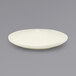 A white Front of the House Kiln porcelain plate with a small rim.