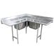 A stainless steel Advance Tabco three compartment sink with two drainboards.