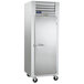 A Traulsen G Series reach-in refrigerator with a white metal door.