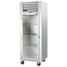 A Traulsen G Series glass door reach-in refrigerator with a white cabinet.