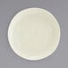 A close up of a Kiln vanilla bean porcelain plate with a small rim.