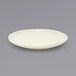 A white Front of the House Kiln porcelain plate with a small rim.