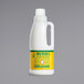 A white jug of Mrs. Meyer's Honeysuckle Fabric Softener with a green and yellow label.