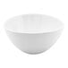 A white oval tall porcelain bowl with a 42 oz. capacity.