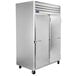 A large silver Traulsen G Series reach-in freezer with two doors.