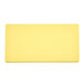 A yellow rectangular Vollrath cutting board.