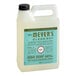 A white plastic container of Mrs. Meyer's Basil Scented dish soap refill with a green and blue label.