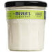 A Mrs. Meyer's Clean Day Lemon Verbena scented wax candle in a glass jar.