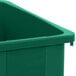 A green Carlisle Trimline rectangular plastic trash can.