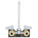 A chrome Equip by T&S wall mount faucet with 2 gooseneck spouts and lever handles.