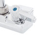 A chrome Equip by T&S wall mounted faucet with lever handles.