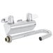 A silver Equip by T&S wall mounted faucet with a gooseneck spout and lever handles.
