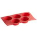 a red silicone muffin pan