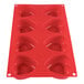 A red Thunder Group heart shaped silicone mold with 8 compartments.