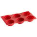 A red Thunder Group silicone dahlia mold with 6 compartments.