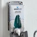 A Rubbermaid foam hand soap refill in a wall-mounted soap dispenser.