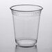 A clear plastic Fabri-Kal cup on a white surface.