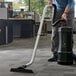 a person vacuuming the floor