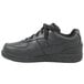 A black leather Genuine Grip women's shoe with laces.