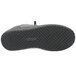 A close-up of a Genuine Grip black leather shoe with black rubber soles and laces.