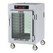 A white Metro C5 reach-in heated holding cabinet with clear glass doors.