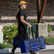 a woman carrying a blue bag