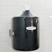 A black Merfin Mates box for center pull wipes on a white wall.