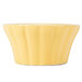 A yellow floral ramekin with a wavy edge.
