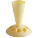 A yellow plastic cone-shaped object with holes.