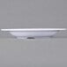 A close-up of a white Carlisle melamine bowl.