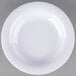 A close-up of a white Carlisle melamine bowl with a curved edge.