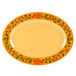 A white oval platter with a yellow and green floral design.