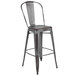 A Flash Furniture distressed silver metal bar stool with a vertical slat back.