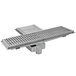 An Eagle Group metal floor trough with a square drain cover.