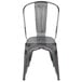 A Flash Furniture distressed silver metal restaurant chair with a vertical slat back.