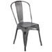 A Flash Furniture metal chair with a distressed silver finish and a slat back.
