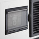 A close-up of a black panel on an Avantco Air Cooled Ice Machine.