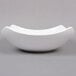 An American Metalcraft square white stoneware bowl with a curved edge.