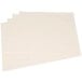 A stack of ivory flat pack paper napkins.