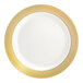 A round bone or ivory plastic plate with a gold lattice design around the rim.